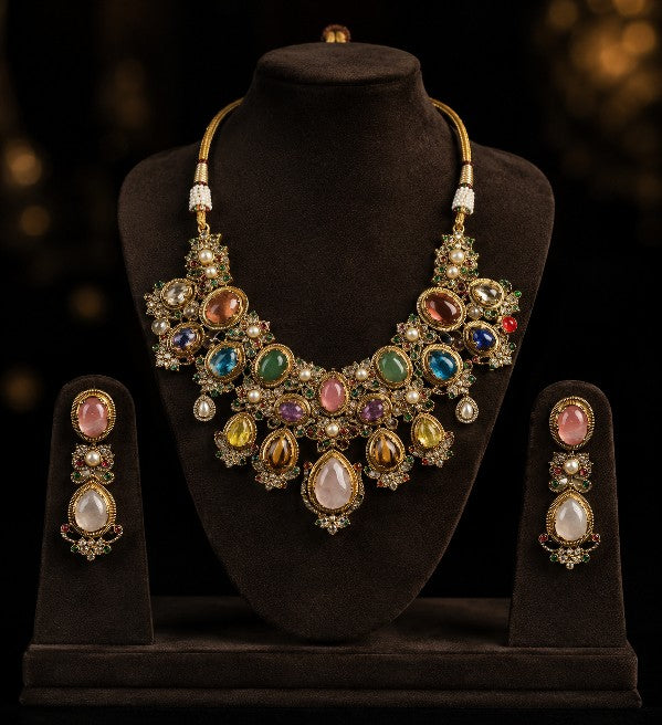 Tavisi Navaratna Royale moissanite necklace set with kundan work, pearls, multicolor navaratna stones and premium gold finish.