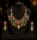 Tavisi Navaratna Royale moissanite necklace set with kundan work, pearls, multicolor navaratna stones and premium gold finish.