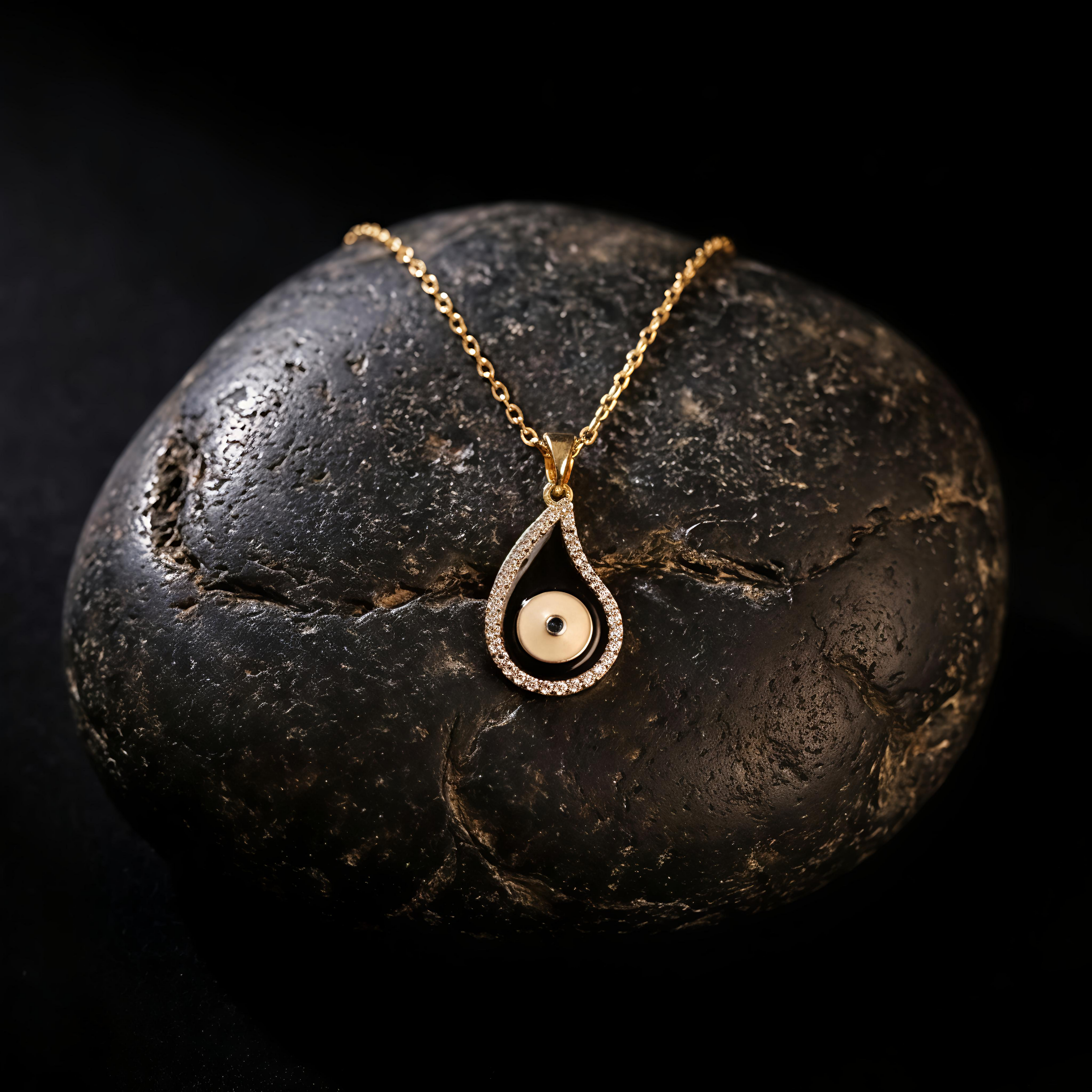 Close-up of Tavisi Nyra Evil Eye Pendant featuring anti tarnish waterproof stainless steel with elegant black and white design
