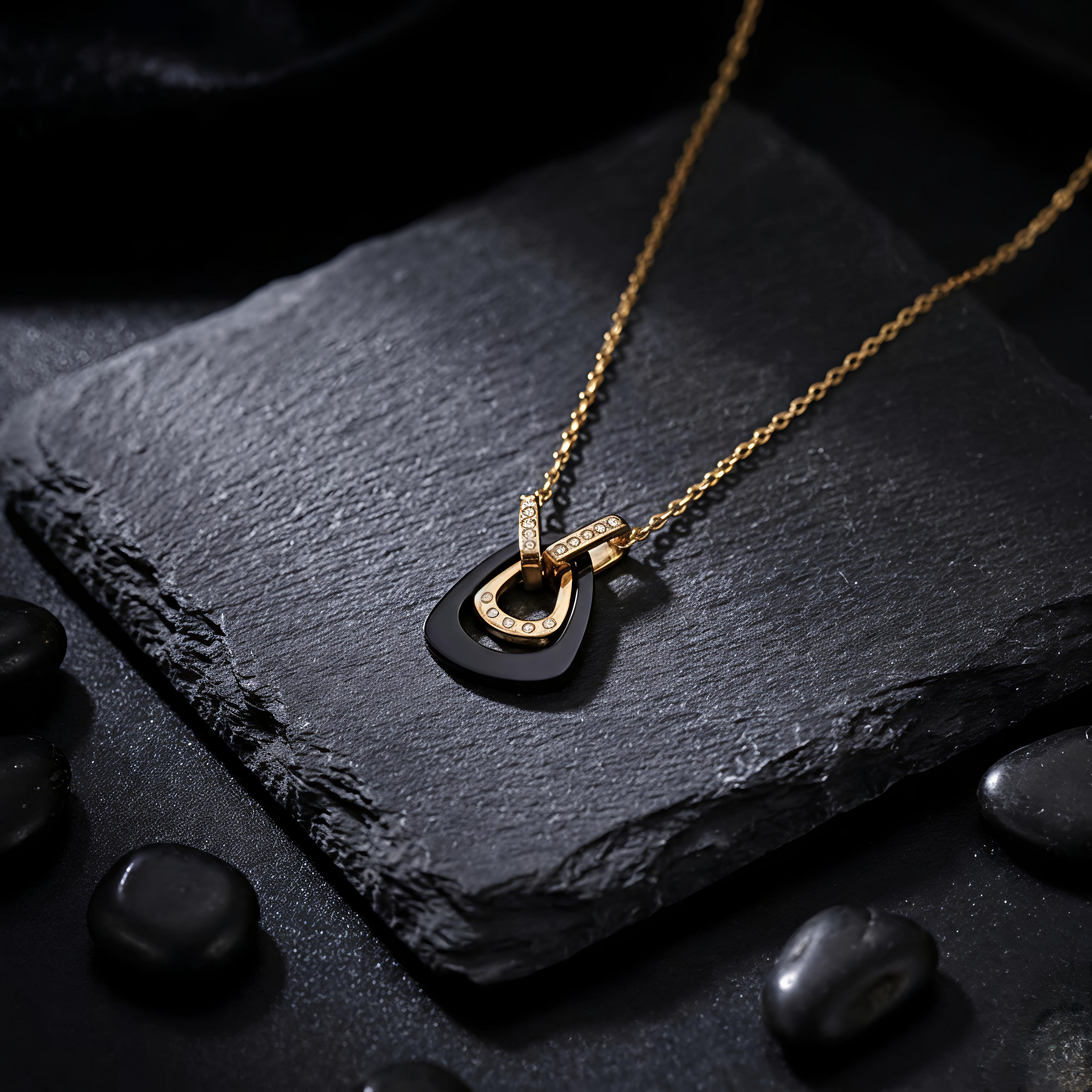 Close up of Tavisi Nyra Noir AD Necklace with black pendant and American Diamond stones, waterproof long lasting gold shine