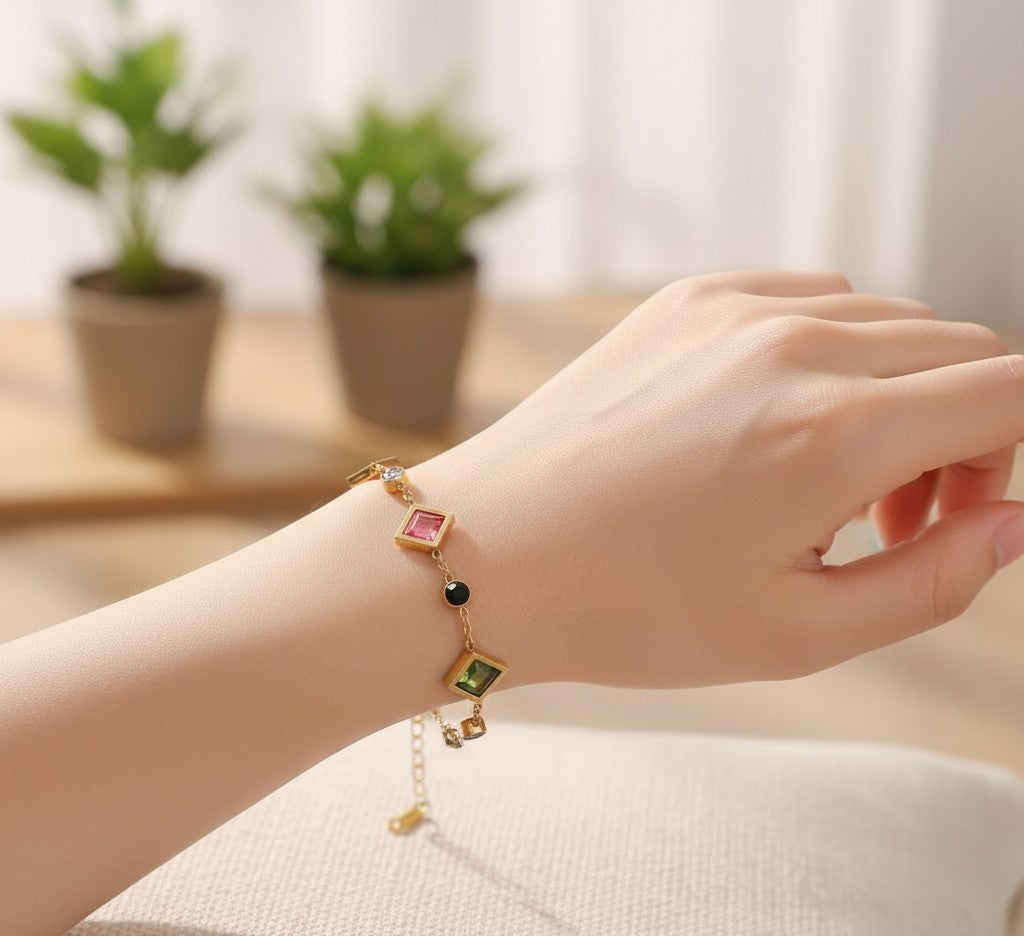 Detailed view of Tavisi Rainbow AD Stone Bracelet with colourful American Diamond stones, 22K gold plated 316L surgical stainless steel and waterproof anti tarnish coating.