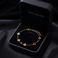 Tavisi Rainbow AD Stone Bracelet crafted in 316L surgical stainless steel with colourful American Diamond stones, 22K gold plating, waterproof anti tarnish finish and long lasting shine.