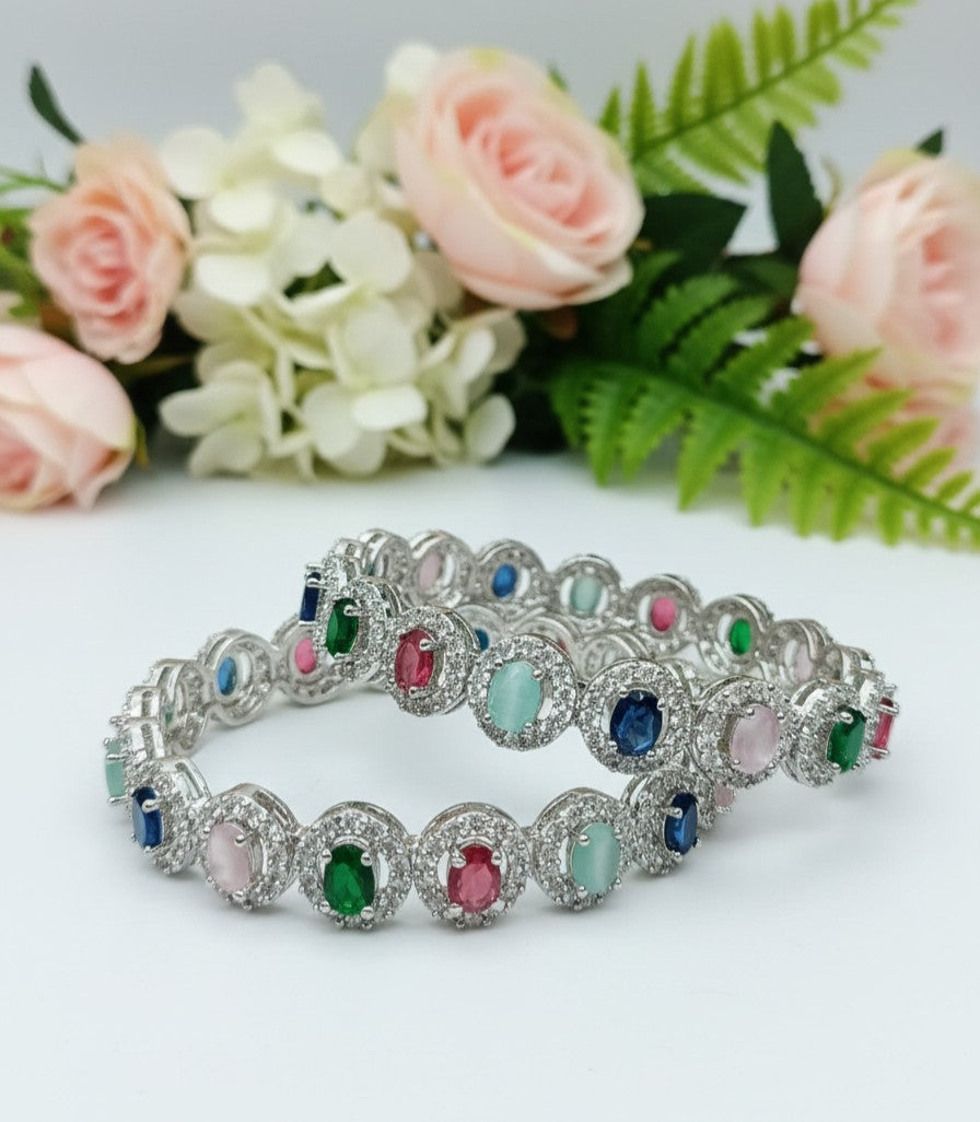 Angle view of Tavisi Rainbow Luxe multicolor CZ silver polish bangle with long lasting finish