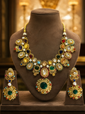 Tavisi Regal Mosaic moissanite necklace set with Kundan, synthetic emeralds, rubies, semi-precious beads and premium gold finish.