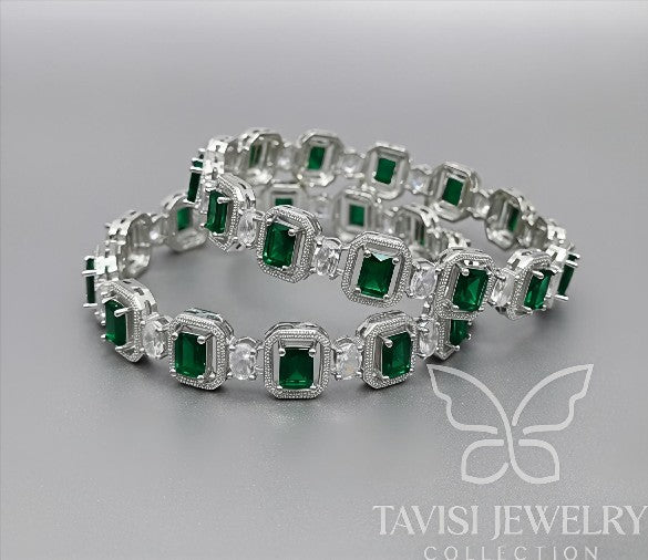 Tavisi Regal Spark CZ Silver Polish Bangles featuring white CZ stones with emerald green center stones, premium silver polish finish, displayed on a white background. Available in sizes 2.6 and 2.8.