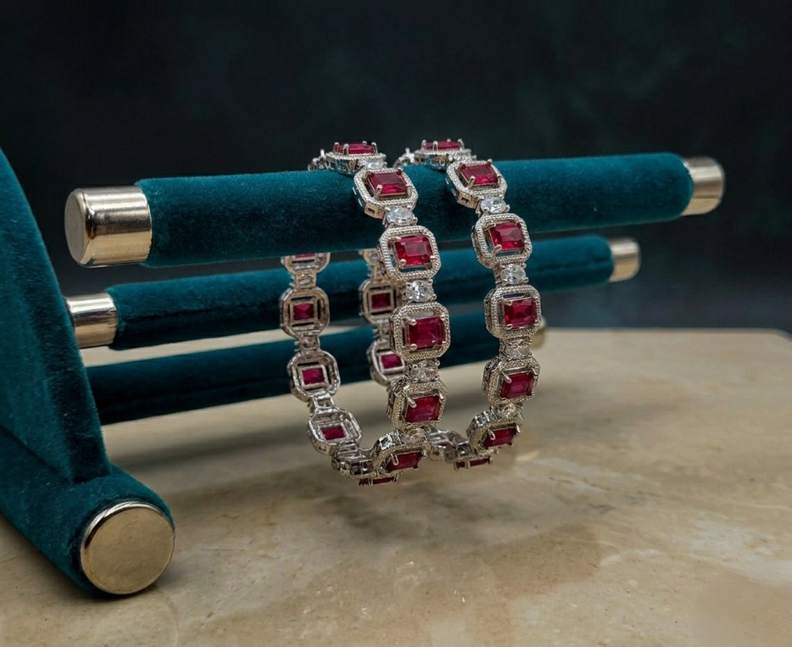 Front view of Tavisi Regal Spark ruby CZ silver polish bangle size 2.6 for women