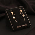 Tavisi rose gold pearl wave drop earrings with 18K rose gold plating and anti tarnish finish for women