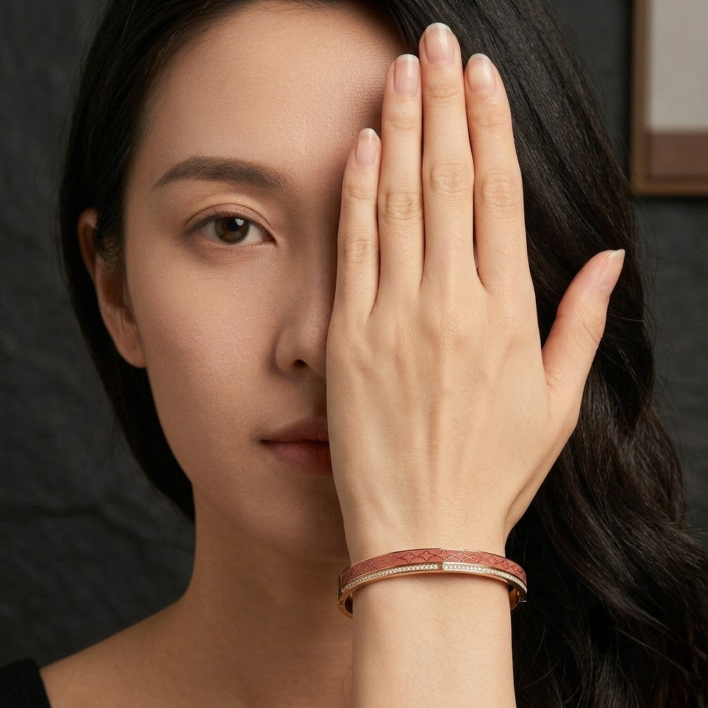 Woman wearing Tavisi Roselle Glow 22K gold plated anti tarnish bracelet with pink enamel and AD stones.