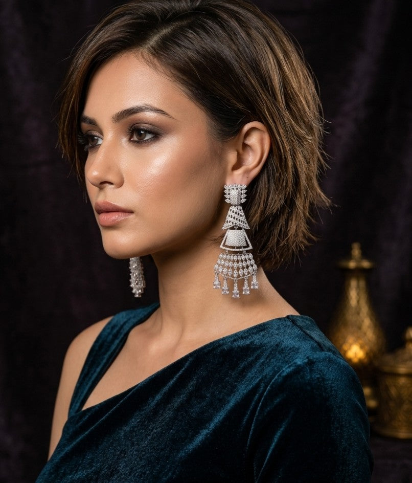 Female model wearing Tavisi Royal Cascade Premium Brass AD CZ Designer Statement Earrings