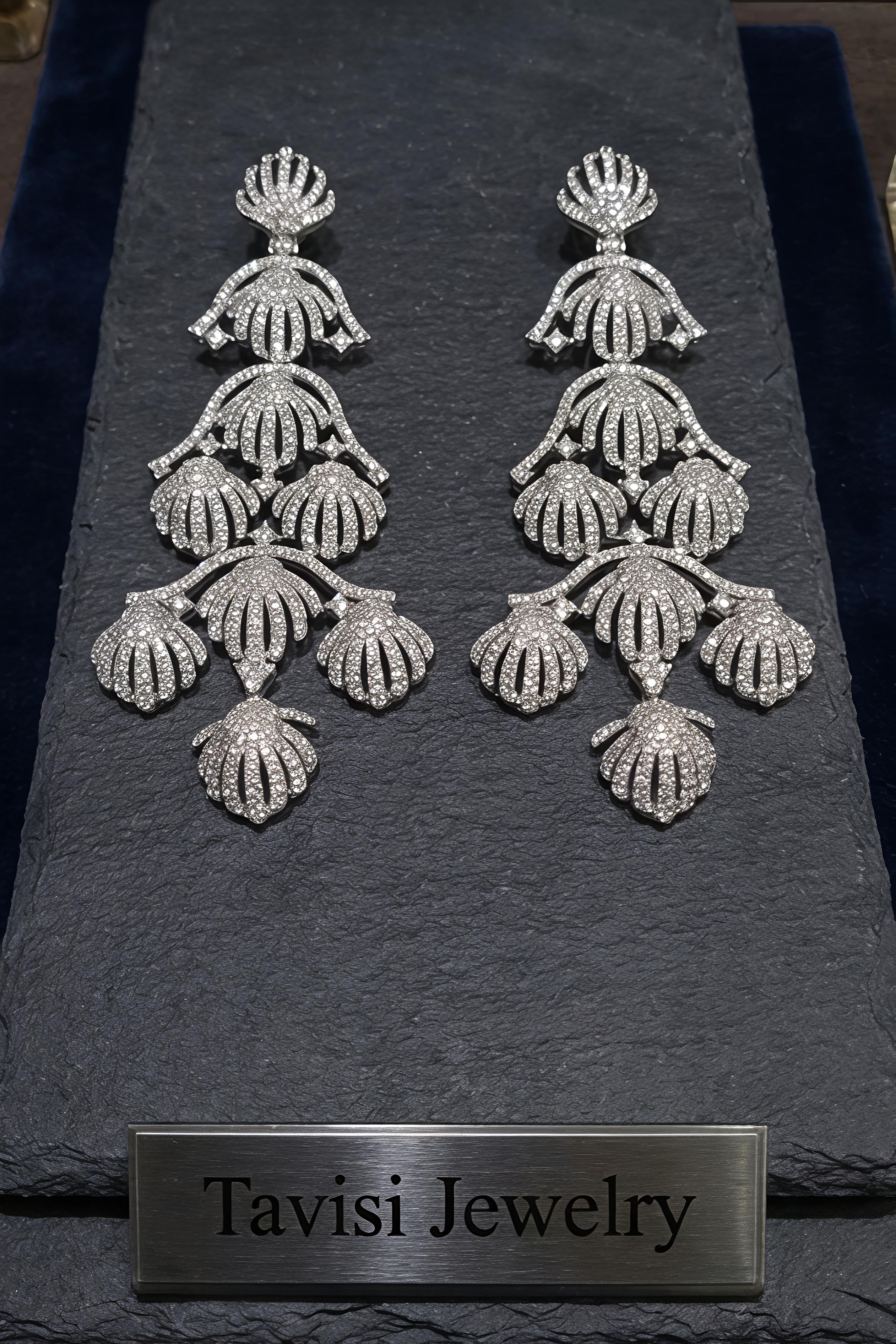Front view of Tavisi royal shell chandelier earrings with sparkling AD and CZ stones in silver tone finish