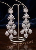 Royal Tavisi shell chandelier earrings displayed in premium luxury presentation with silver tone AD and CZ stones