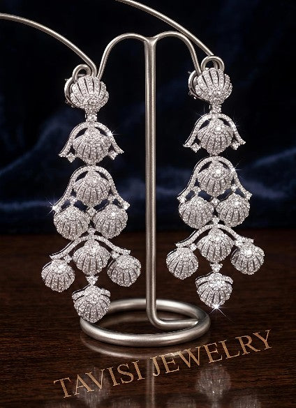 Royal Tavisi shell chandelier earrings displayed in premium luxury presentation with silver tone AD and CZ stones