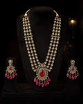 Tavisi Ruby Royale layered necklace set with AD stones, white CZ stones, ruby red stones, ruby beads, brass casting and mehanti color finish.