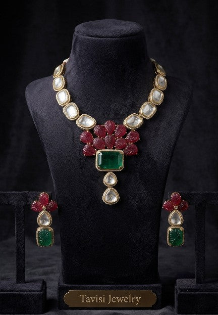 Tavisi Sabyasachi inspired ruby and emerald AD Kundan floral statement necklace set with matching earrings in premium brass.