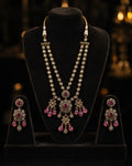 Tavisi Ruby Noir layered necklace set with AD stones, CZ stones, ruby pink beads, brass casting and mehanti