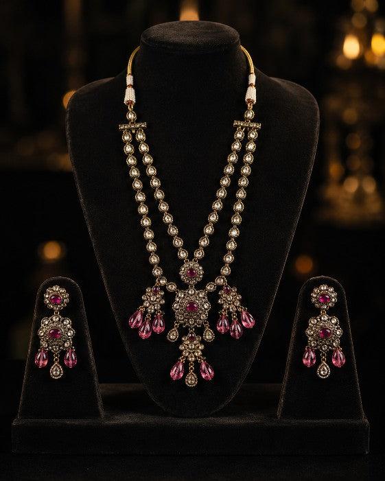 Tavisi Ruby Noir layered necklace set with AD stones, CZ stones, ruby pink beads, brass casting and mehanti