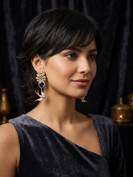 Woman wearing Tavisi Sabyasachi Inspired Blue Bird Motif AD CZ Gold Plated Brass Statement Earrings