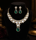 Tavisi Sabyasachi inspired green AD Kundan statement necklace set with matching earrings in premium brass.