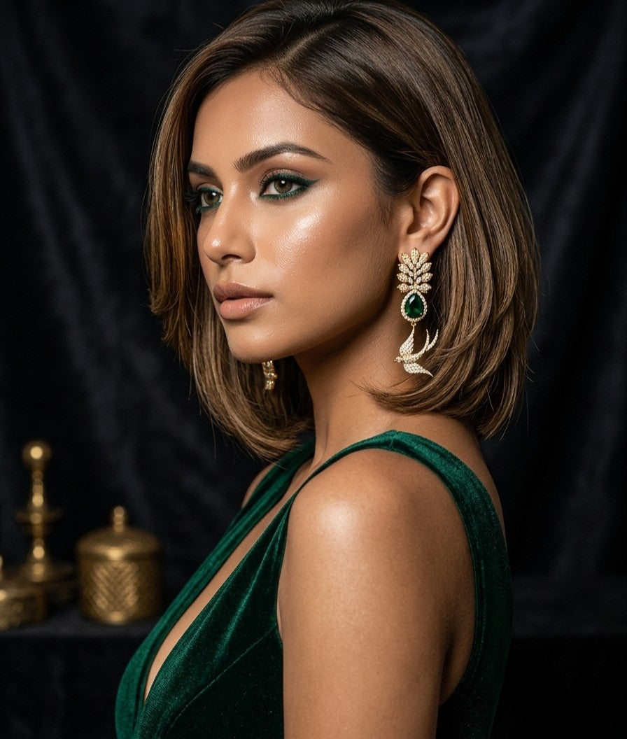 Female model wearing Tavisi Sabyasachi Inspired Green Bird Motif AD CZ Gold Plated Brass Designer Earrings