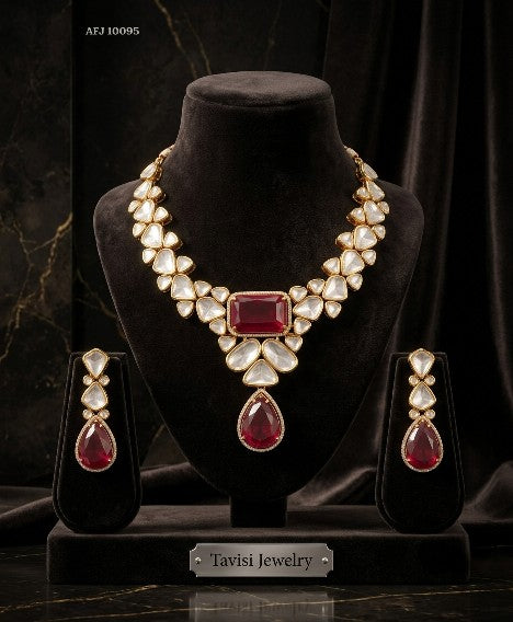 Tavisi Sabyasachi inspired ruby red AD Kundan statement necklace set with matching earrings in premium brass.