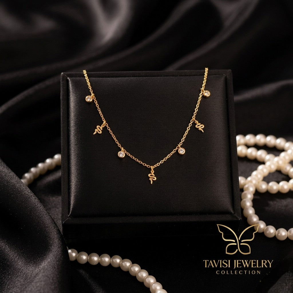 Tavisi Serpina Gold Snake Charm Tanmaniya Necklace with premium AD American Diamond stones 316L surgical stainless steel and 22K anti tarnish finish 
 
