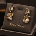 Tavisi smoky grey rectangle crystal drop earrings with 22K gold plating and anti tarnish finish for women