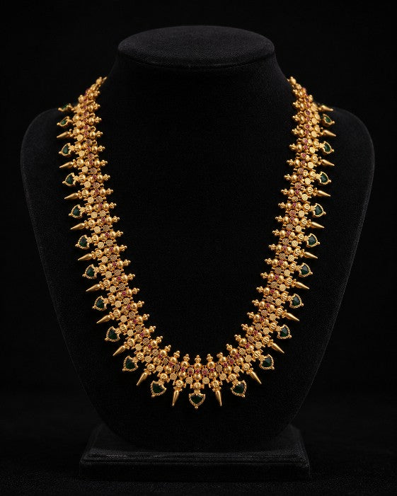 Tavisi traditional palakka necklace with green and ruby AD CZ stones in gold finish