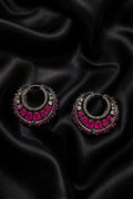 Tavisi Victorian Pink Stone Hoop Earrings with white AD accents and black metal finish displayed on black satin fabric.