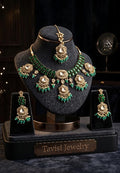 Tavisi long lasting brass casting mehendi finish CZ AD kundan bridal necklace set with green stones, green beads and white pearls.