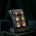Tavisi triple crystal drop earrings with AD stones and 22K gold plated finish for women