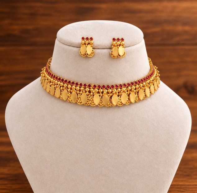 Emerald green Coin Elakkathali choker with traditional coin motifs in antique gold finish
