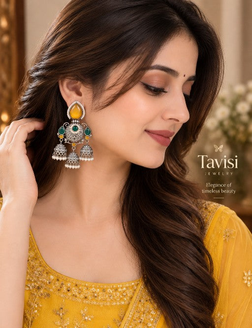 Woman wearing Vanya Premium AD pearl traditional dangler earrings