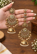 Woman wearing Varenya Premium Jewellery Kundan AD Stone floral jhumka earrings with pearl drops