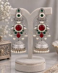 Vasundhara Premium Peacock green ruby jhumka earrings with silver-look finish