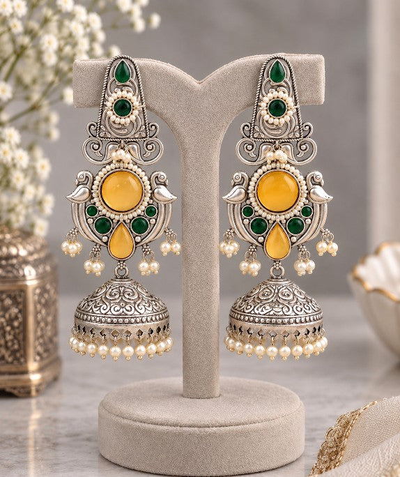 Vasundhara Peacock jhumka earrings with red and green artificial stones