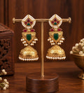 Virelia Premium green ruby lotus jhumka earrings with pearl detailing