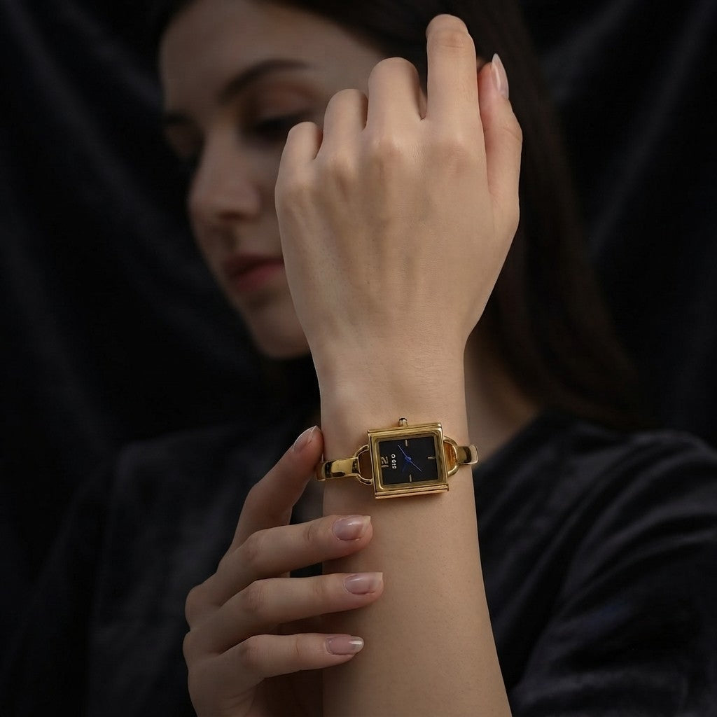 Close up of ZIDO premium gold plated rectangle watch kada with black dial and blue watch hands